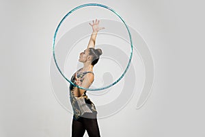 Fitness activity and healthy lifestyle. woman doing exercise with hula hoop.