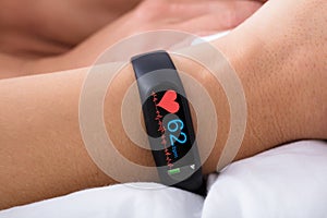 Fitness Activity Tracker With Heartbeat Rate On Woman`s Hand