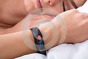 Fitness Activity Tracker With Heartbeat Rate On Woman`s Hand