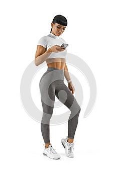 Fitness athlete trainer using app on smarphone phone wearing smartwatch