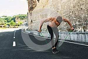 Fitness Athletic Muscular Man Exercising, Doing Expander Workout