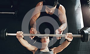 Fitness, bench press and woman with personal trainer for support, help and safety in gym workout. Weightlifting