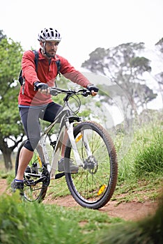 Fitness, bike and man cycling in off road for adventure, discovery or mountain biking hobby. Exercise, health and sports