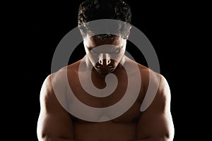 Fitness, body and man in studio for thinking, wellness or muscle training results on black background. Chest, abs and