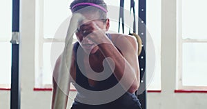 Fitness, bodybuilder and woman with rope in gym for exercise, weightlifting and intense training. Sports, challenge and