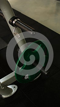 Fitness or bodybuilding concept background. Product photograph of old iron dumbbells on grey, conrete floor in the gym. Photograph