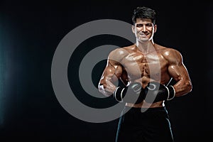 Fitness and boxing concept. Boxer, man fighting or posing in gloves on black background. Individual sports recreation.