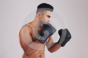 Fitness, boxing gloves and sports man ready for exercise, training and workout in studio for health, wellness and sport