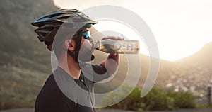 Fitness, break and man cyclist drinking water while cycling in nature. Exercise, workout and endurance with male drink