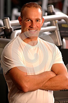 Fitness center fit man smiling