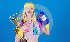 Fitness champion. Champion concept. Girl successful modern woman hold golden goblet of champion. Woman good in tennis