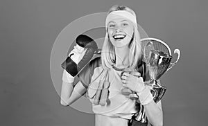 Fitness champion. Champion concept. Girl successful modern woman hold golden goblet of champion. Woman good in tennis