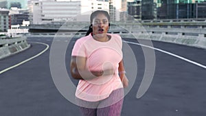 Fitness, city and black woman running on road for weightloss, body wellness and healthy lifestyle. Sports, endurance and