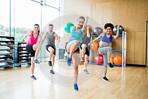 Fitness class exercising in the studio