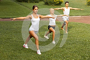 Fitness class. Portrait of smiling people doing power fitness ex