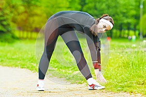 Fitness Concept: Caucasian Woman Stretching Body During Outdoor