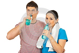 Fitness couple drinking water