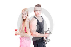 Fitness couple holding weights