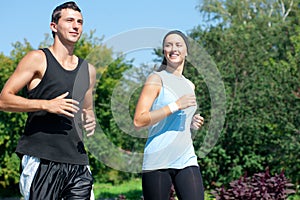 Fitness couple jogging in park