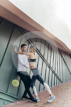 Fitness couple standing outdoors. Sport, workout, healthy lifestyle concept