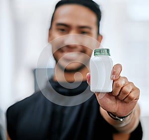 Fitness drugs, hand and a man at the gym with a supplement for training and sport. Happy, portrait and an Asian athlete