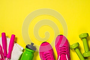 Fitness equipment flat lay image on color background.