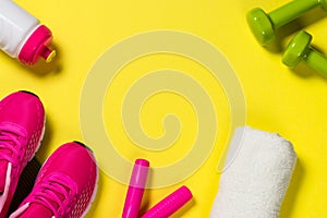 Fitness equipment flat lay image on color background.