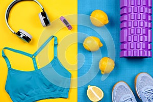 Fitness equipment. Woman workout accessories and clothes flat lay. Top view, fitness background