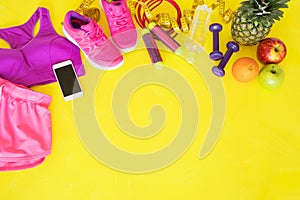 Fitness equipment on yellow background