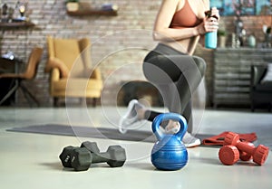 Fitness equipments at home. Focus on fitness tools, barbell and kettlebell. Concept about home workout, fitness, sport and health