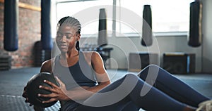 Fitness, exercise and black woman on floor with ball for core training, balance and workout on yoga mat. Sports, Russian