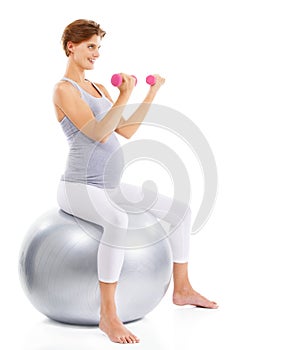 Fitness, exercise and pregnant woman weightlifting on ball for maternal wellness, healthy lifestyle and wellbeing