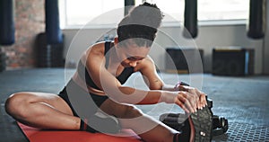 Fitness, exercise and woman on floor stretching legs to start training, warm up and workout on yoga mat. Sports center