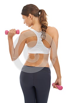 Fitness, exercise and woman in studio with dumbbell for workout, muscle training and body building. Gym, power and