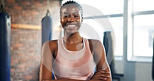 Fitness, face and a black woman with arms crossed at the gym for health, sports or workout. Happy, portrait and an