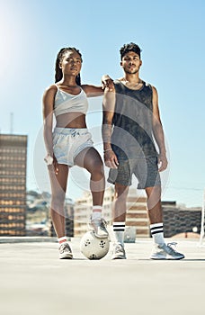 Fitness, football and exercise couple with motivation, workout and sports training in the city. Man and woman athlete