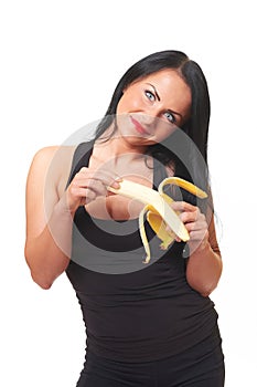 Fitness girl with banana isolated on white