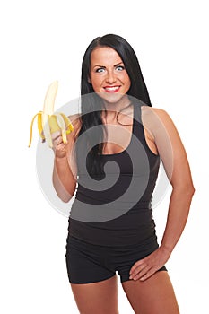 Fitness girl with banana isolated on white