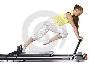 Fitness girl doing pilates on the allegro photo