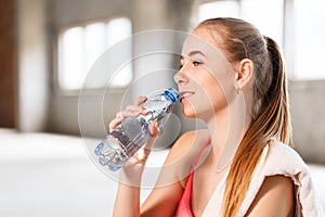 Fitness Girl Drinking Water After Training