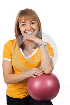Fitness girl with a red ball