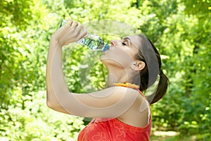 Fitness girl refreshing