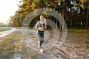 Fitness girl running in the park