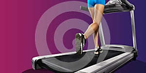 Fitness girl running on treadmill. sporty woman with muscular legs.