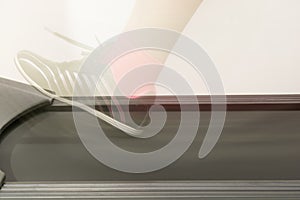 Fitness girl running on treadmill. Woman with muscular legs on w