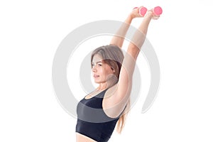 Fitness girl is standing sideways picked up two hands