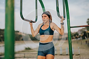 Fitness Girl Stretching and Exercising Outdoors for Active Warm-Up