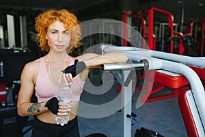 Fitness Girl With Strong Body Having Break Between Cardio Workout. Sporty Woman In Fashion Sportswear Resting After Intense