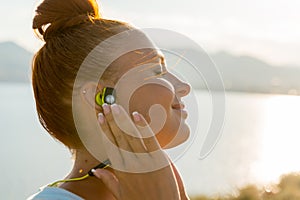 Fitness girl with wireless headphones