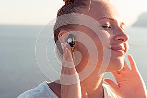 Fitness girl with wireless headphones